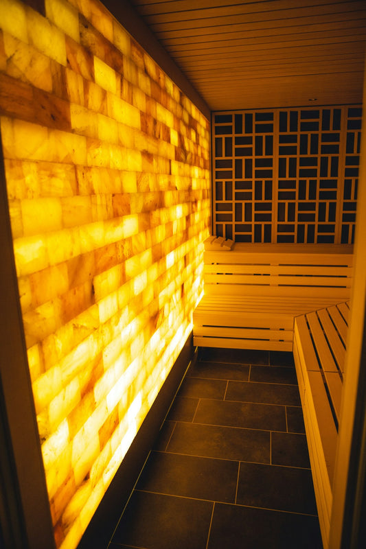 Luxury sauna space with natural wood and warm lighting